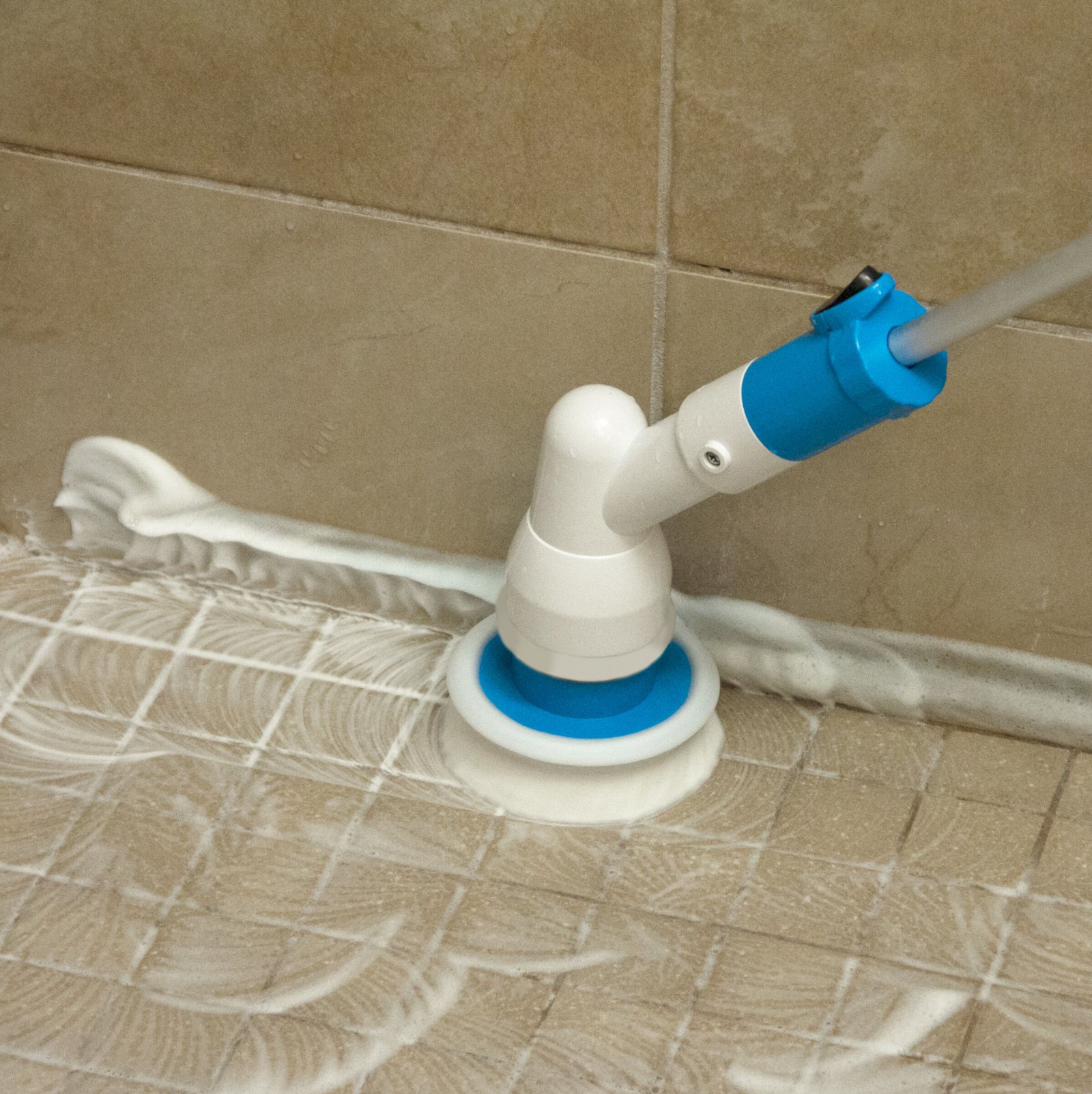 cleaning tiles with an electric brush
